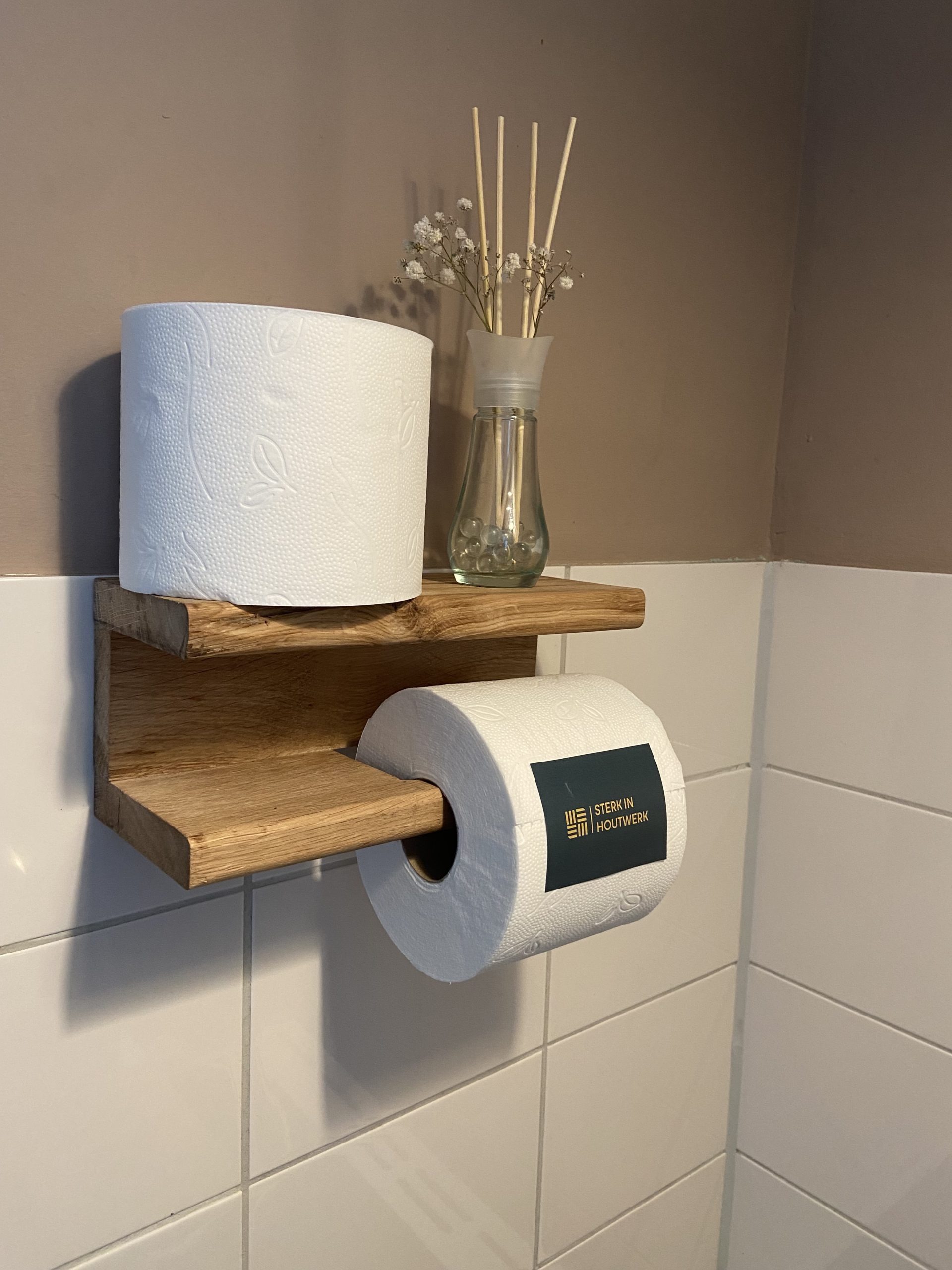 Toiletrol houder